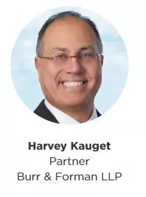 Harvey Kauget with Title